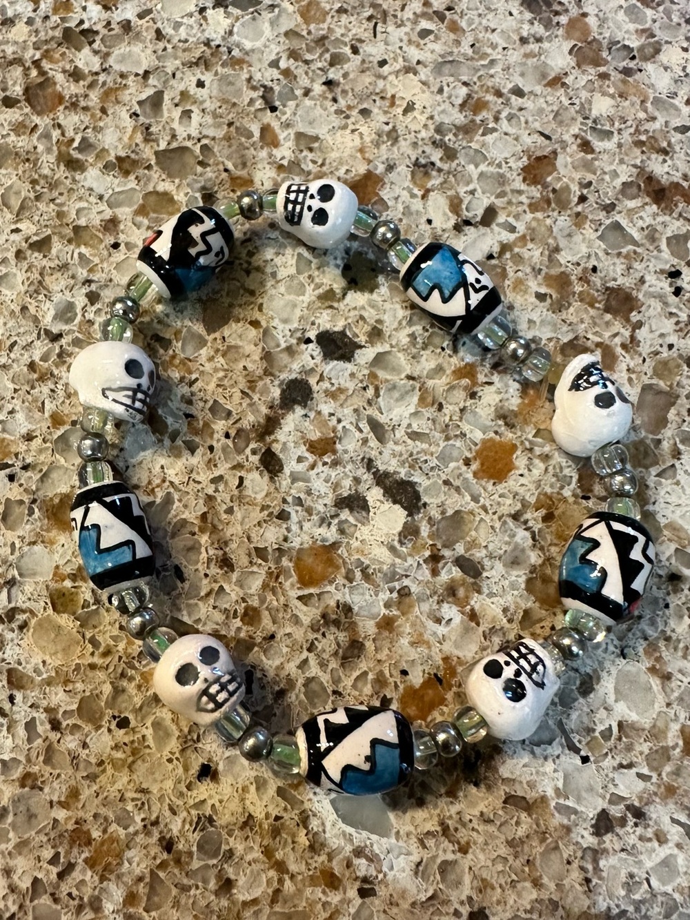 Made in Peru- Handmade Skull Bead Stretch Bracelet in White and Teal